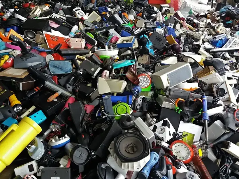 Pile of used electronic and housewares waste division