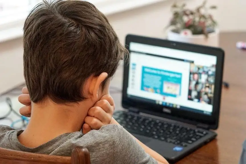 child using laptop on internet