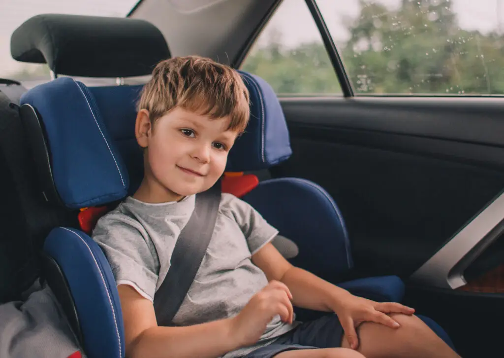 A five year old child sitting in a child restraint seat in texas