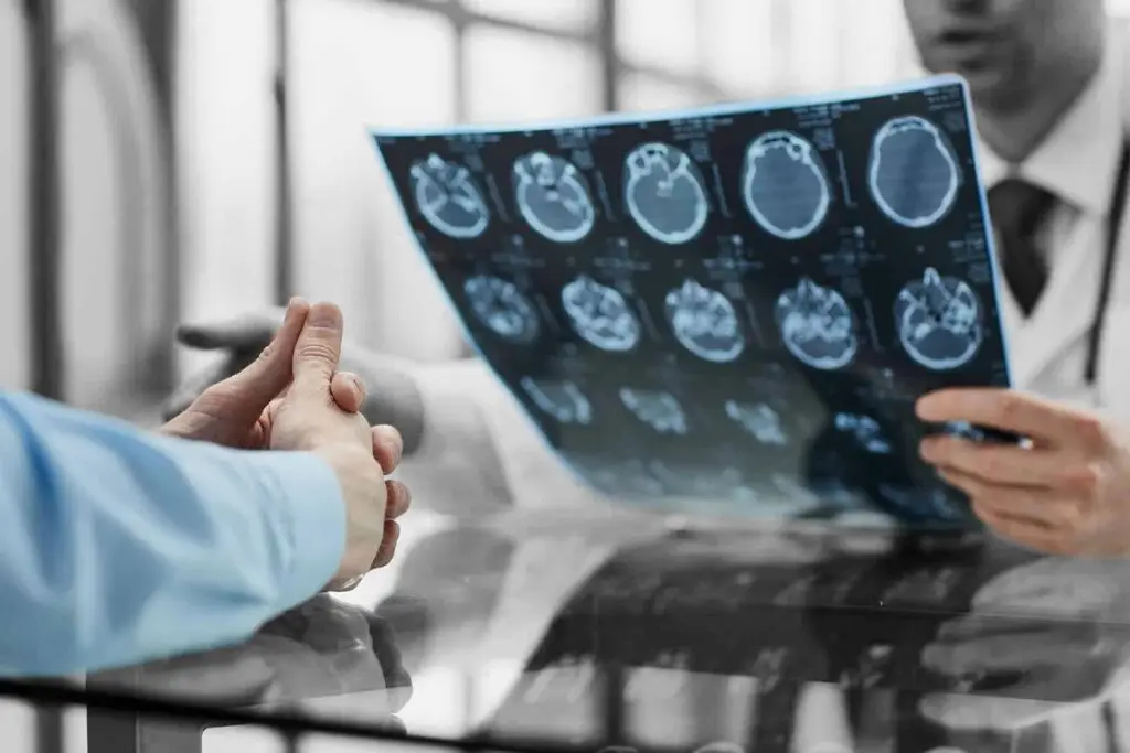 Patient at a reception at the doctor looking an x-ray