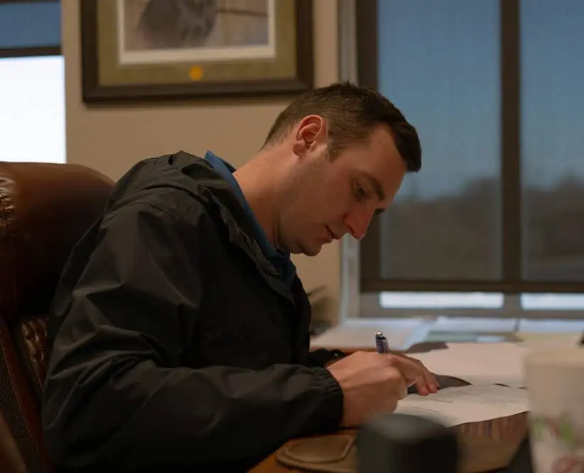 Man writing on a paper