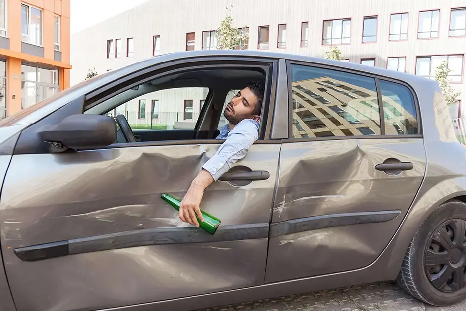 Do not drive drunk. Man driving automobile after drinking beer