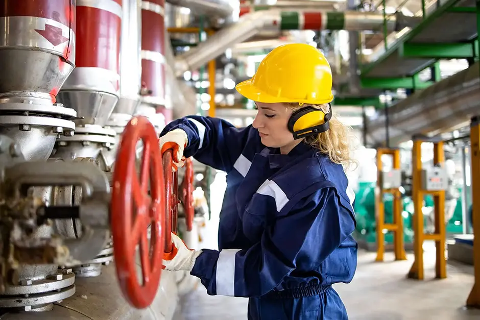 Professional refinery worker in protective uniform