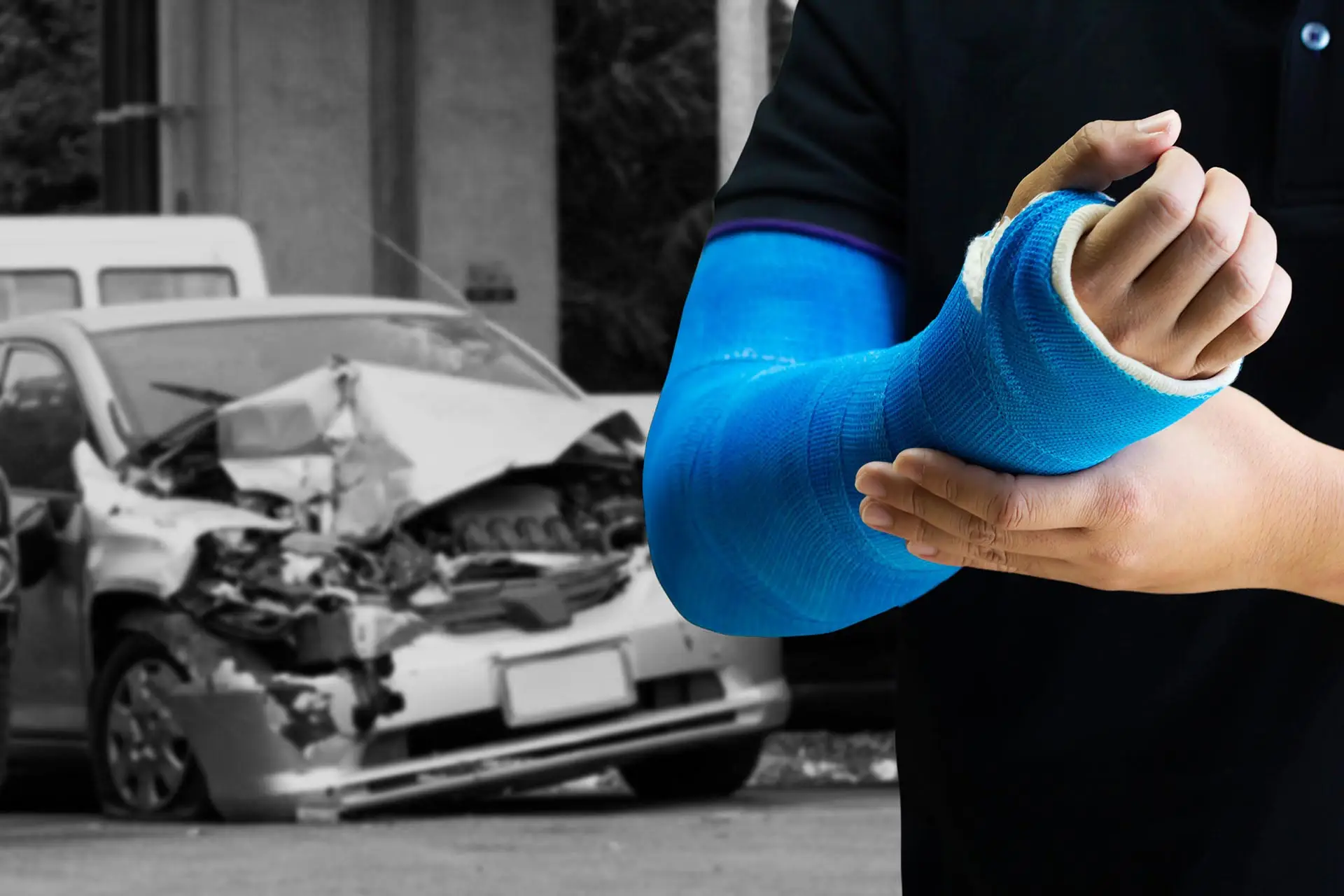 Close up man holding hand with blue bandage as arm injury concept with car accident