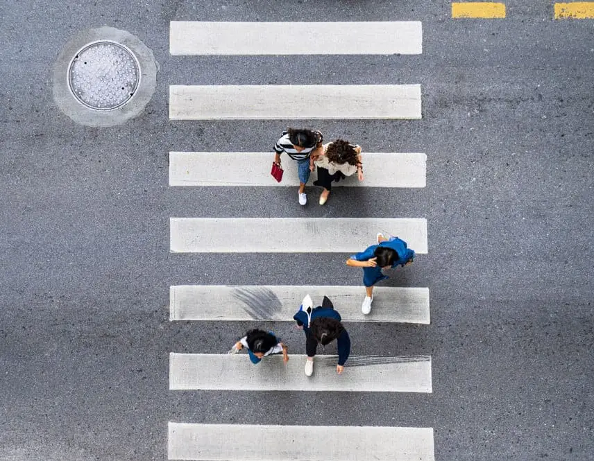 Aerial photo top view of people walk on street in the city over pedestrian crossing traffic road
