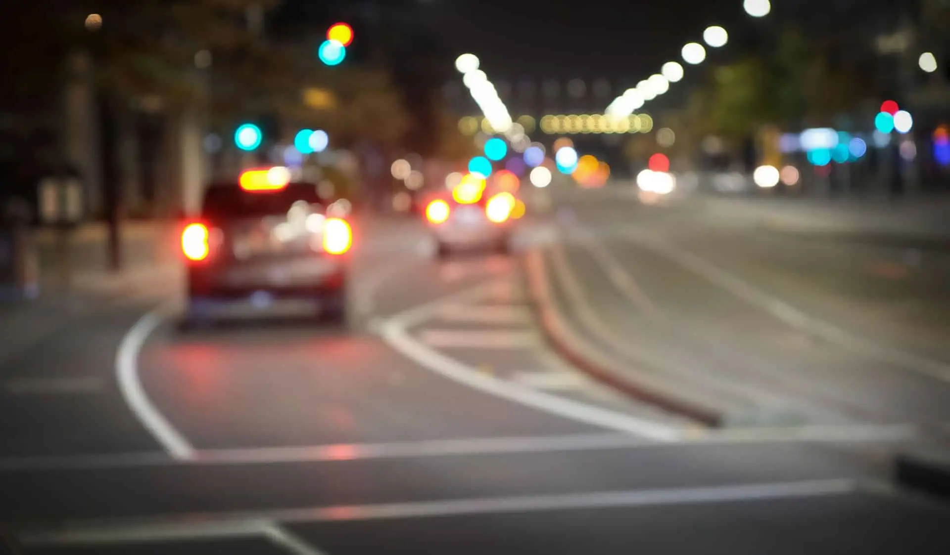 Driving in the night, blurred city road