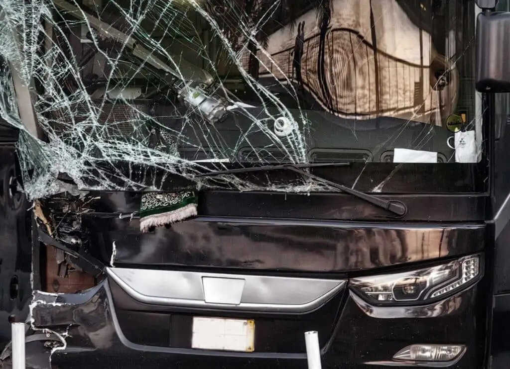 The large windshield of the bus was shattered but not in pieces