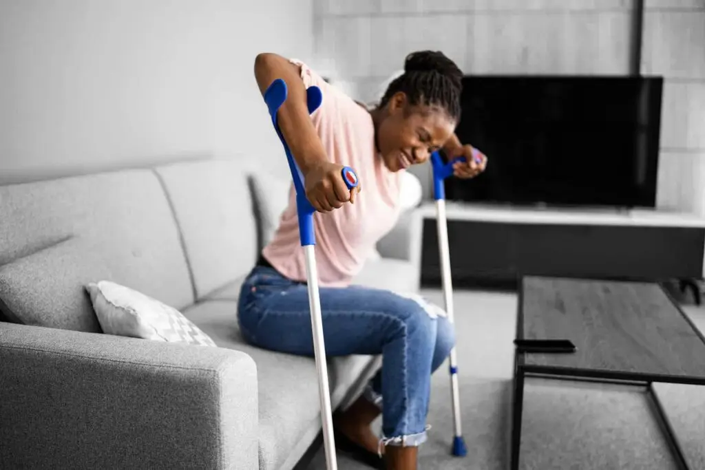 Walking with crutches. Injured broken leg or knee