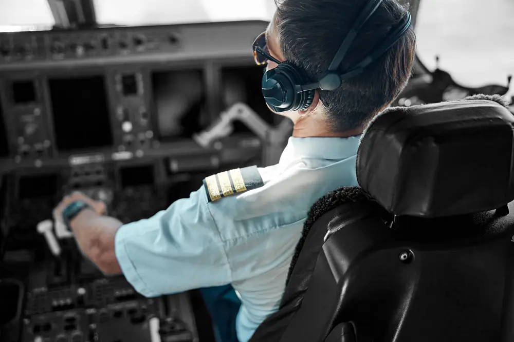 Top view of man in aviation uniform and earphones