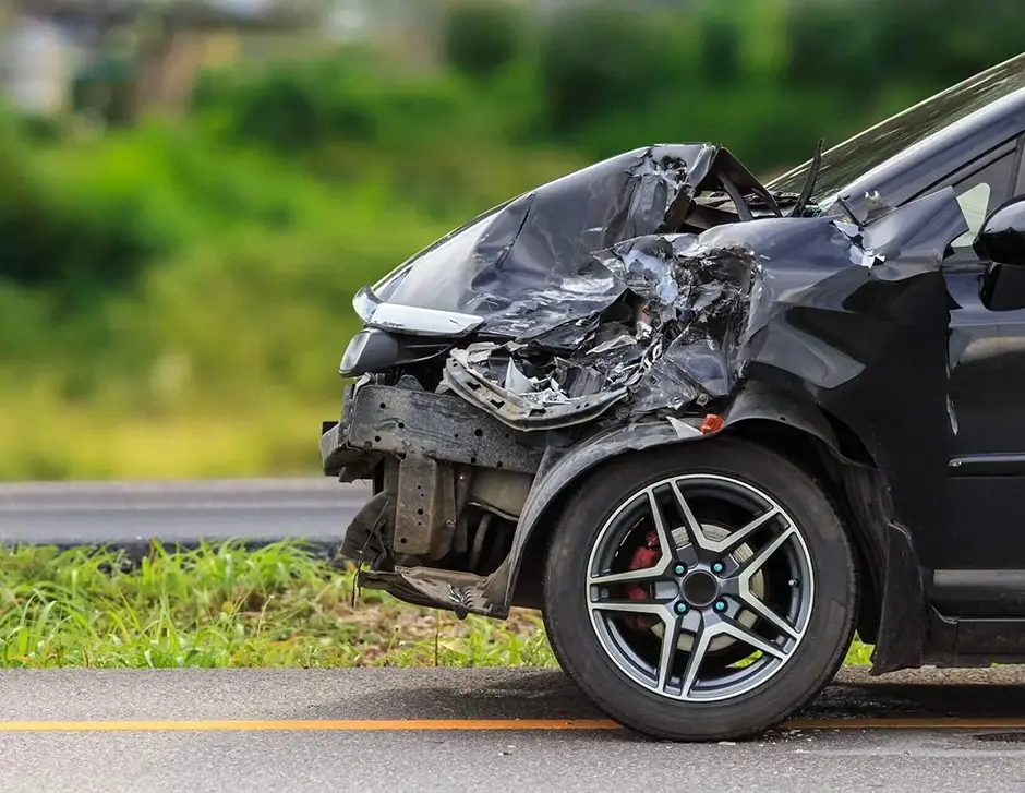 Front of black car get damaged by accident on the road